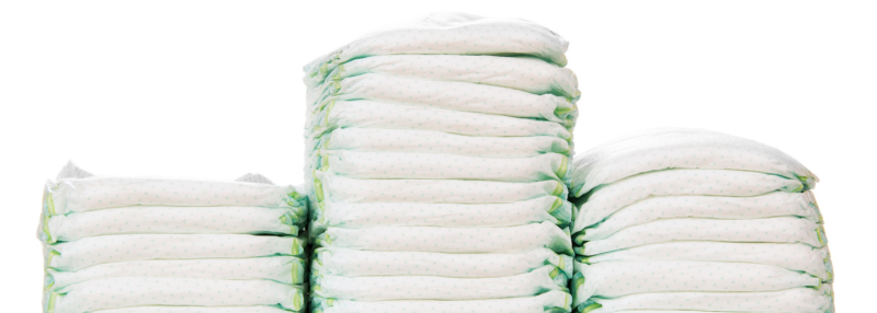 Three stacks of diapers on white background